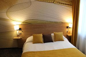 Łóżko lub łóżka w pokoju w obiekcie In Situ Hotel