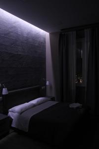 A bed or beds in a room at City Break Nomentana