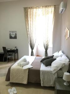 Posteľ alebo postele v izbe v ubytovaní Soggiorno Paradiso