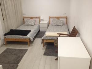 Cama o camas de una habitación en casa das pombas