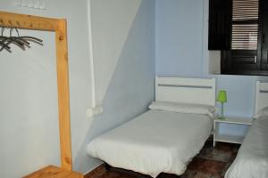 Postel nebo postele na pokoji v ubytování Pension Castil