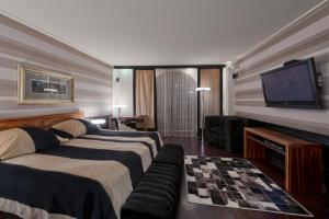 Posteľ alebo postele v izbe v ubytovaní Hotel Wentzl