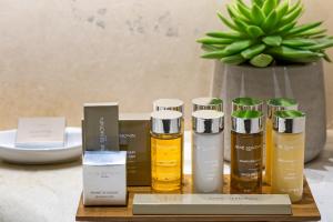 a group of three bottles of essential oils on a table at Rodos Park in Rhodes Town