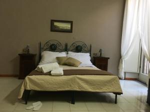 Posteľ alebo postele v izbe v ubytovaní Soggiorno Paradiso