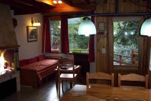 a living room with a couch and a fireplace at Cabañas Temporada in San Martín de los Andes +45 photos