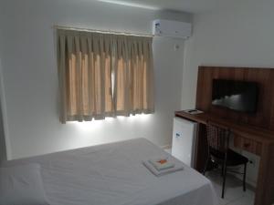 Cama ou camas em um quarto em Hotel Folley