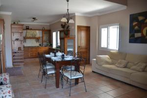 a living room with a table and a couch at Chalet Canarias in Telde
