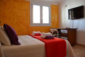 Tempat tidur dalam kamar di Chalet Canarias