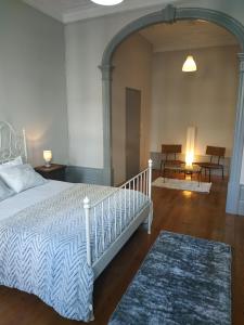 a bedroom with a bed and a dresser at Gabriel Guesthouse in Porto