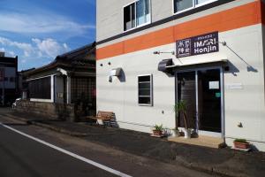 a building with a sign for a mental hospital at Guesthouse Imari Honjin in Imari