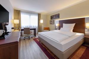 Postel nebo postele na pokoji v ubytování Mercure Hotel Duisburg City