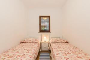Postel nebo postele na pokoji v ubytování Apartments Villa Adria