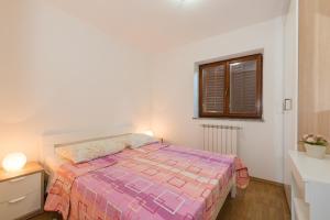 Postel nebo postele na pokoji v ubytování Apartments Villa Adria