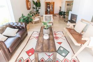 a living room with a couch and a table at Dreamsea Surf Guest House in Sintra