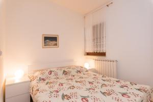 Postel nebo postele na pokoji v ubytování Apartments Villa Adria