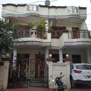a scooter parked in front of a house at Pratibha Home stay in Jabalpur +45 photos