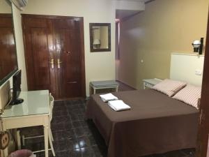 Posteľ alebo postele v izbe v ubytovaní Hotel Molino De Saydo
