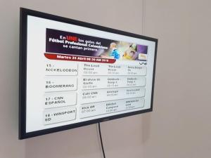 a television screen with a presentation on it at HOSPEDAJE VALLE DEL LILI in Cali