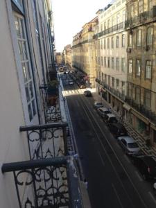 a view of a city street from a balcony at Great Stay Fanqueiros 1 in Lisbon