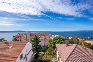 a view of a city with buildings and the water at Apartments Villa Maria in Crikvenica