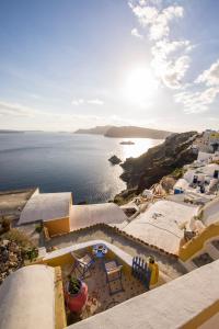 an aerial view of the ocean and buildings at Annouso Villa with Hot Tub by Caldera Houses in Oia