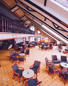 a large room with tables and chairs and tablesktop at The Green Park Kartepe in Masukiye