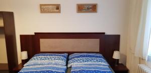 Posteľ alebo postele v izbe v ubytovaní Pension & Restaurace Na Rychtě
