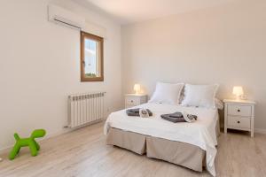 Llit o llits en una habitació de Villa Can Turquesa / Casa Turquesa