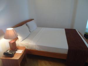 Voodi või voodid majutusasutuse Global Towers Hotel & Apartments toas