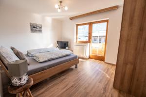 Łóżko lub łóżka w pokoju w obiekcie Apartments Wimpissinger