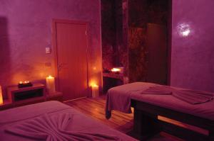 A bed or beds in a room at The Green Park Kartepe