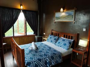 מיטה או מיטות בחדר ב-Misty Mountain Villas