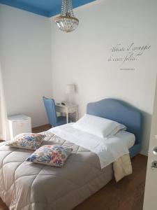 En eller flere senge i et værelse på La Dimora del Conte