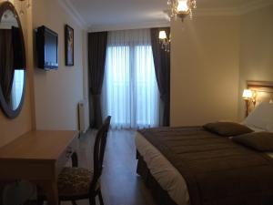 TV a/nebo společenská místnost v ubytování Sultan Palace Hotel