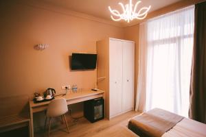 TV a/nebo společenská místnost v ubytování Savaneti Eco Hotel