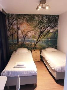 Postel nebo postele na pokoji v ubytování Hotel Velsen