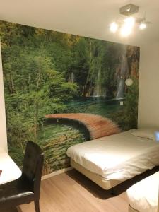 Ένα ή περισσότερα κρεβάτια σε δωμάτιο στο Hotel Velsen