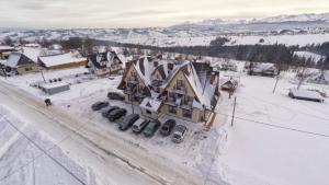 an aerial view of a town in the snow at Pokoje gościnne U Semlów in Bańska