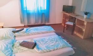 Postel nebo postele na pokoji v ubytování Penzion Lara
