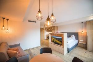 A bed or beds in a room at Dining & Living Alpenrose