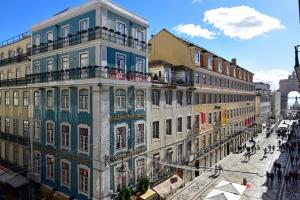 a group of buildings on a city street at My Story Hotel Augusta in Lisbon