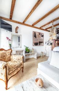 a living room with a couch and a mirror at Limeri Traditional Guest House in Monólithos