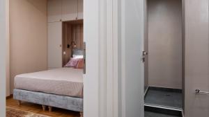 A bed or beds in a room at Absolute Athens v
