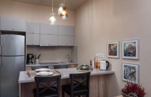 A kitchen or kitchenette at Absolute Athens v