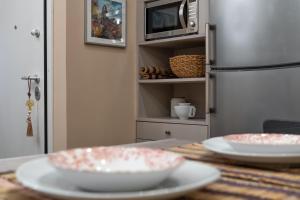 A kitchen or kitchenette at Absolute Athens v