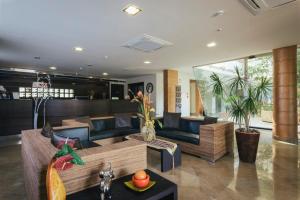 a living room with a couch and a table at Hotel Costa Azul in Balestrate
