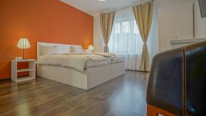 Postel nebo postele na pokoji v ubytování Coroni Residence