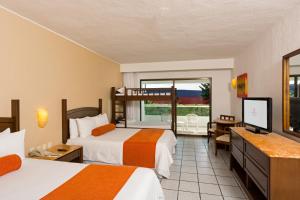 Postel nebo postele na pokoji v ubytování Flamingo Cancun All Inclusive