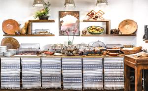 a kitchen with a counter with food on it at Limeri Traditional Guest House in Monólithos