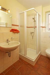 a bathroom with a shower and a sink at Haus Clara Wohnung 02 in Ostseebad Koserow